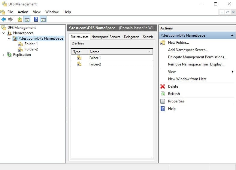 File Explorer در کامپیوتر کلاینت که محتوای ریشه فضای نام DFS \\test.com\DFS NameSpace را با نمایش پوشههای منطقی Folder-1 و Folder-2 نشان میدهد.